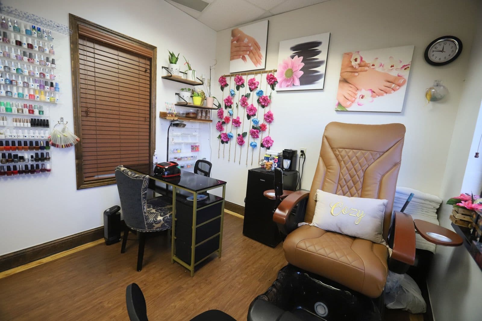 Nail suite at Plaza Park with a pedicure chair, manicure table, and polish wall