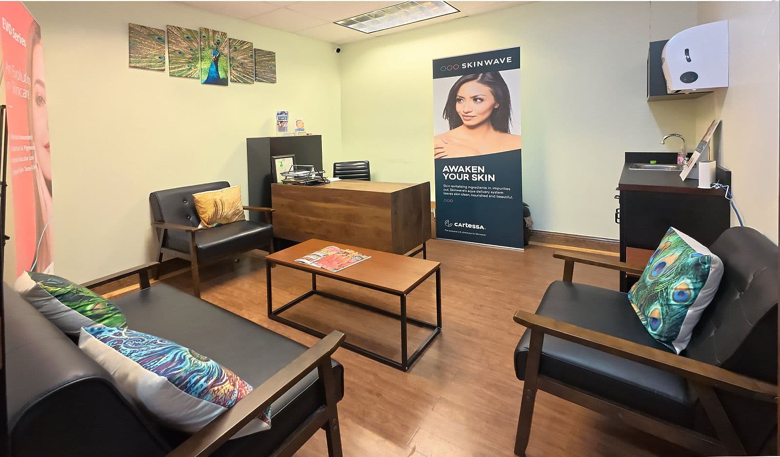 Skincare suite with a client lounge, desk, and seating