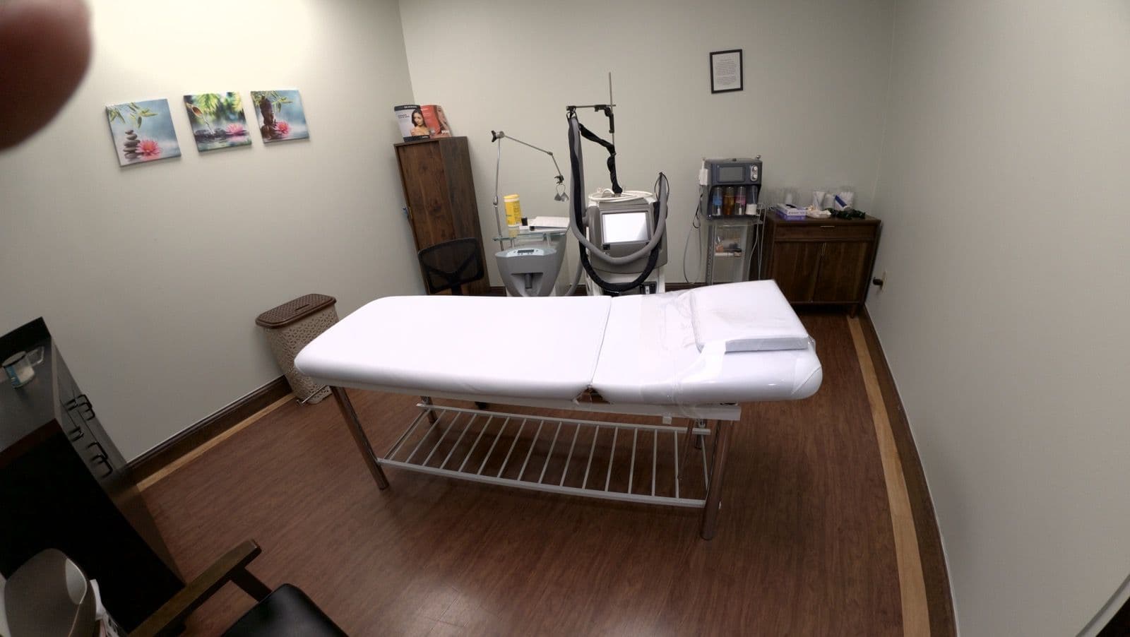 Private treatment room with a treatment bed and equipment